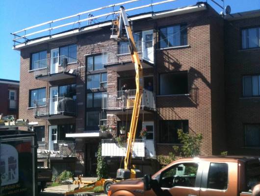 Image de travaux sur un toit plat immeuble